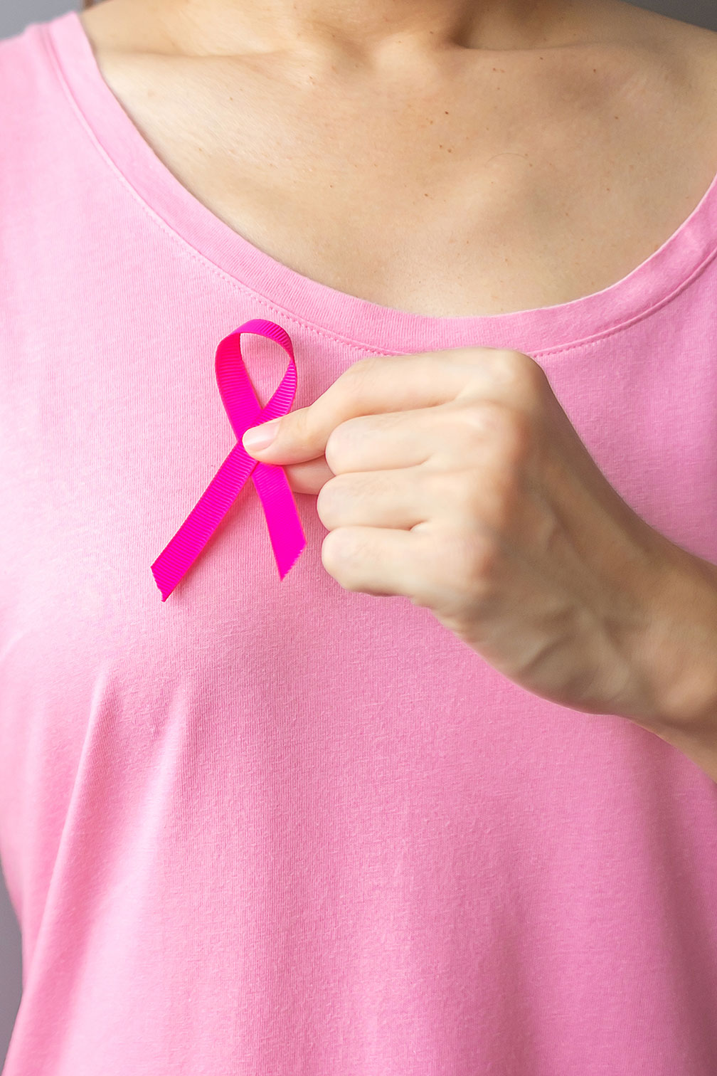 october breast cancer awareness month elderly woman pink t shirt with hand holding pink ribbon supporting people living illness international women mother world cancer day concept