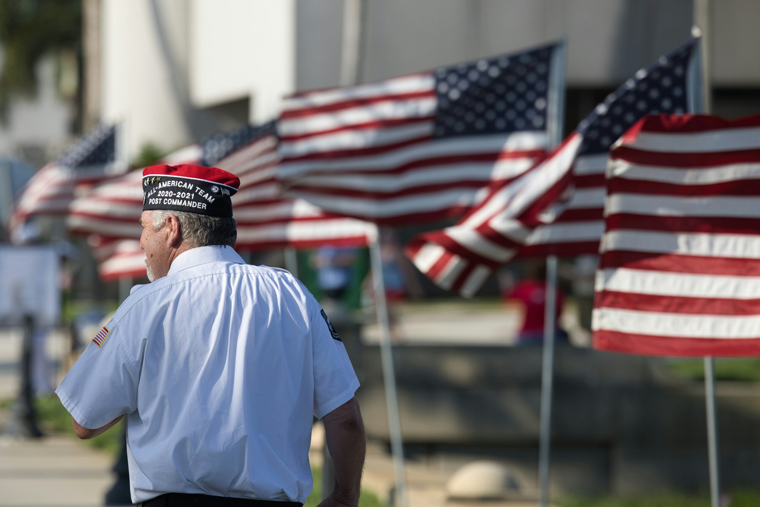 Veteran with flags scaled
